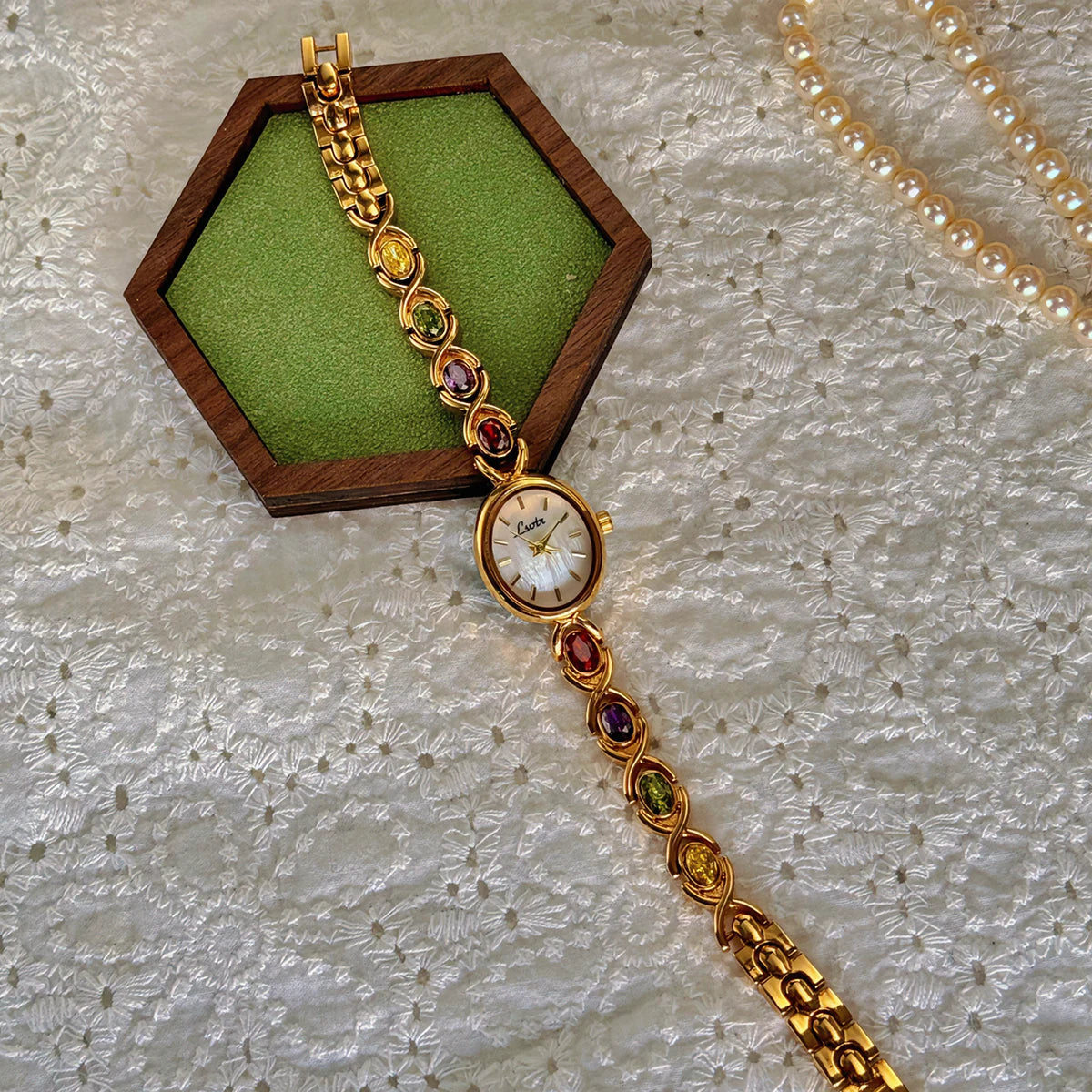 1Pc New High-End Luxury Women'S Watch Embedded with Colorful Tourmalines, Diamonds and an Oval Shaped Mother of Pearl Dial.